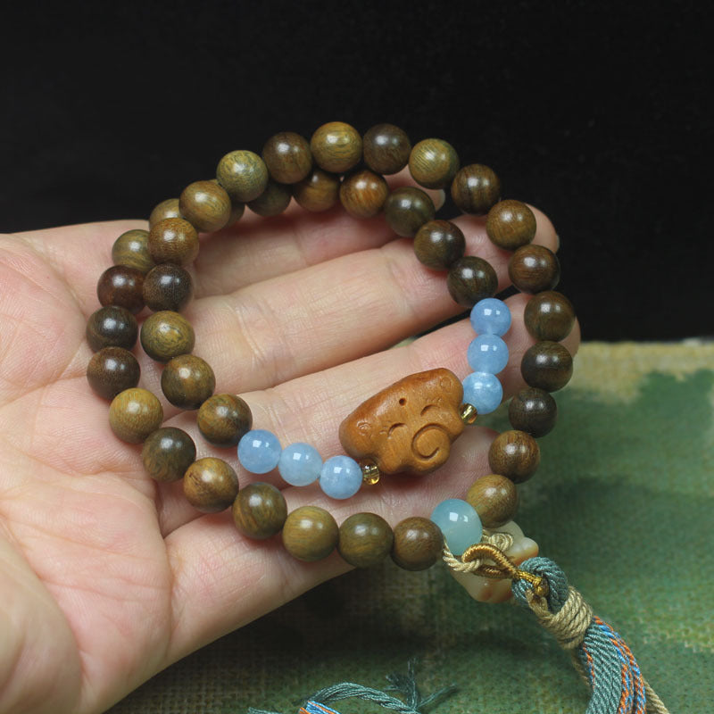Green Sandalwood Double Loop Bracelet – Cloud & Blue Bead Tassel Design