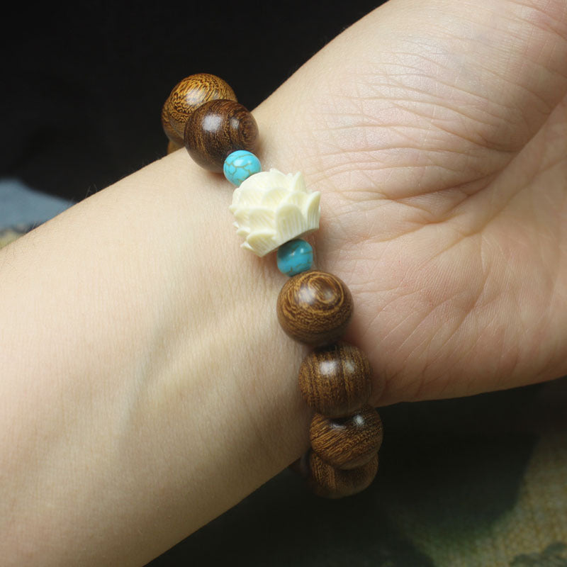 Gold Sandalwood Lotus Bracelet – 12mm Beads with White Lotus & Turquoise Accents