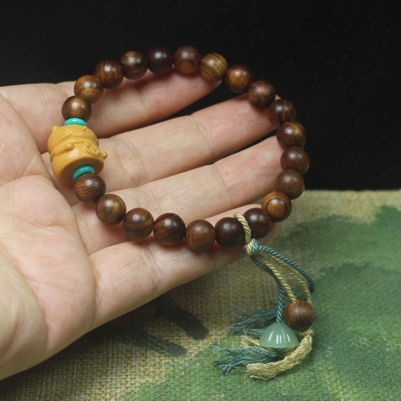 Ebony-Style Bracelet with Lucky Cat Charm – 8mm Beads, Tassel Accent