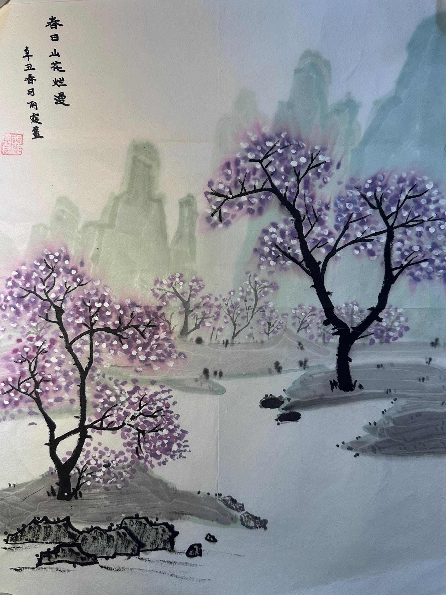 Framed spring landscape Chinese ink painting displayed as Eastern wall art in a calm interior