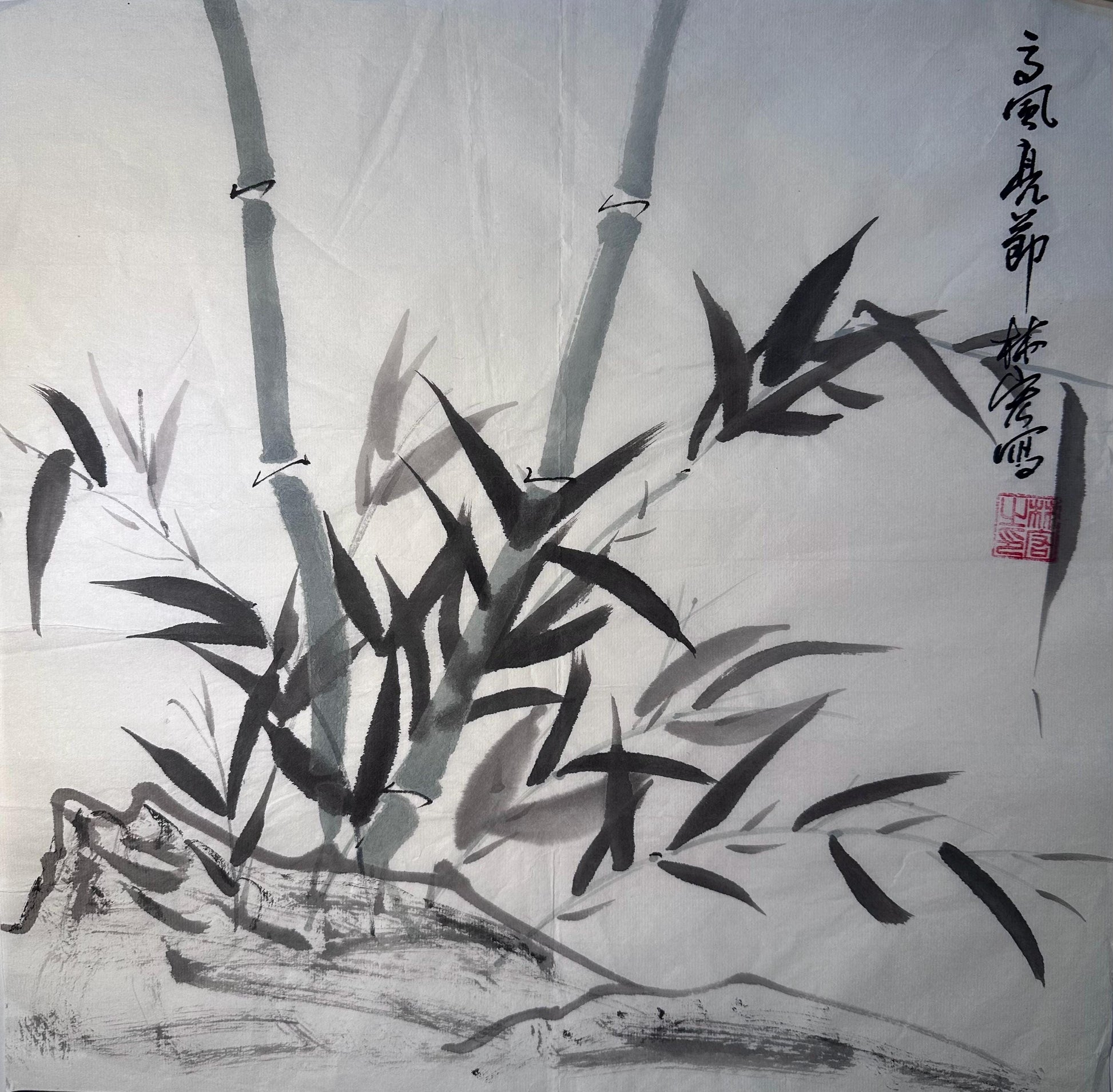 Framed bamboo Chinese ink painting displayed as Eastern wall art in a calm interior